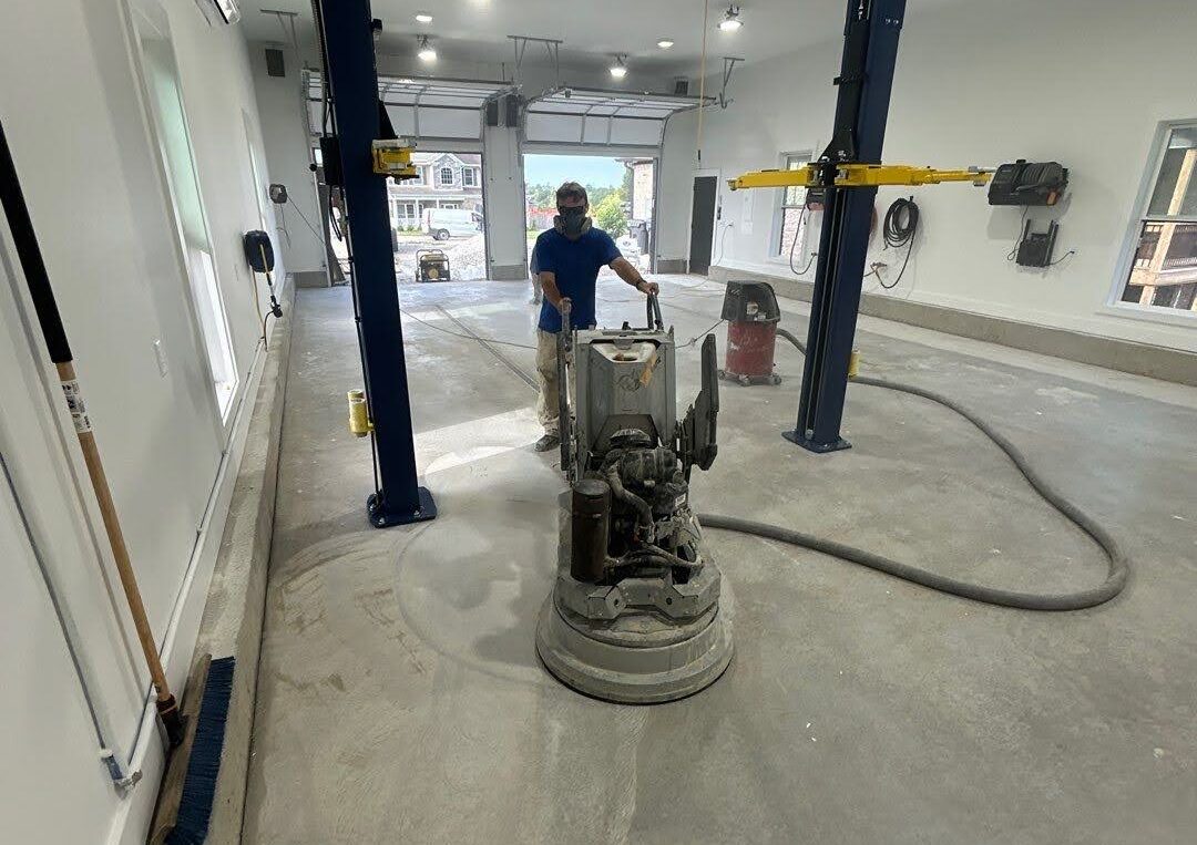 Prepping a garage floor for concrete polyurea coating.